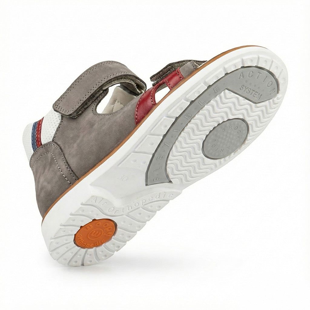 Supportive children’s orthopedic shoe with arch and ankle support, Thomas heels, and shock-absorbing sole.