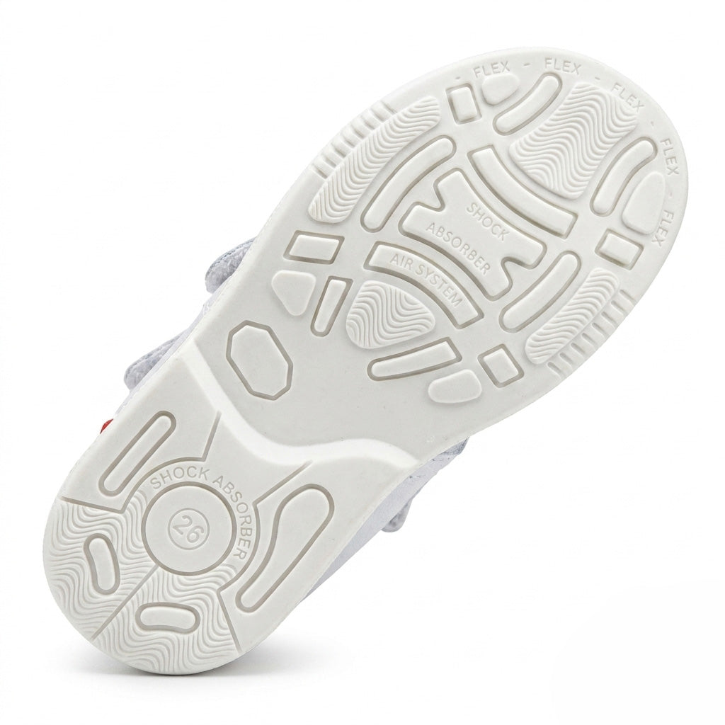 White shoe sole featuring built-in shock absorber traction patterns and an integrated Air System.