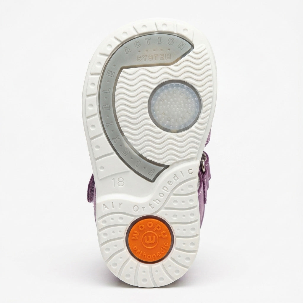 Children’s orthopedic shoe sole with Woopy logo, Air Orthopedic support, Thomas heel and Flexible Action System design.