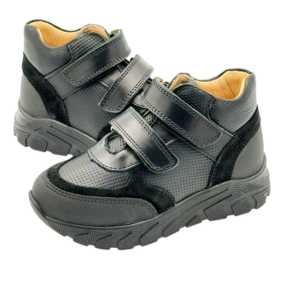 A pair of plain black orthopedic sneakers for kids with arch and enhanced ankle support. These sneakers are designed to meet school dress code requirements while providing optimal foot support and comfort. The picture shows a stylish and durable pair of sneakers, perfect for active kids with specific orthopedic needs.