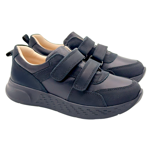 Ortho Shoes black low-top kids' sneakers with dual Velcro straps, arch and ankle support, and anti-slip soles. Designed for active feet and trusted by health professionals.