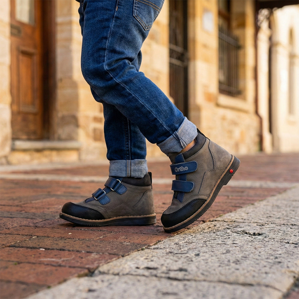 Supportive children’s orthopedic shoes with Velcro straps, arch and ankle support, Thomas heels, and ‘Ortho Shoes’ branding.”