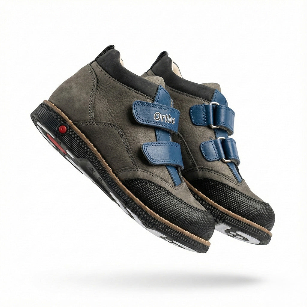 Children’s orthopedic shoes with Velcro closure, arch and ankle support, Thomas heels, and shock-absorbing sole by Ortho Shoes.