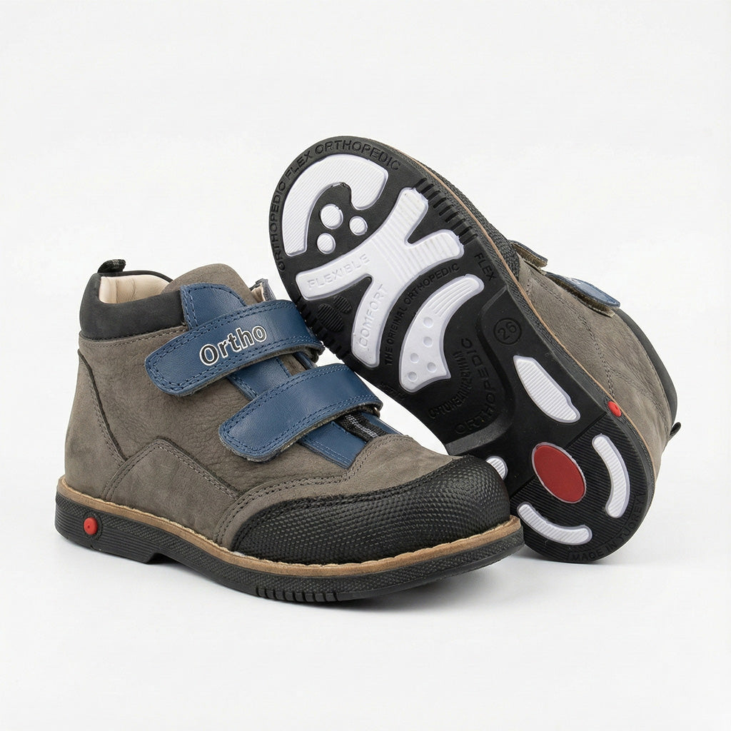 Children’s orthopedic shoes with Velcro closure, arch and ankle support, Thomas heels, and shock-absorbing sole by Ortho Shoes.