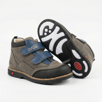 Children’s orthopedic shoes with Velcro closure, arch and ankle support, Thomas heels, and shock-absorbing sole by Ortho Shoes.