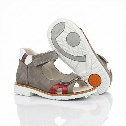 Supportive boys’ orthopedic sandals with Velcro straps, arch and ankle support, Thomas heels, and shock-absorbing sole by WOOPY.