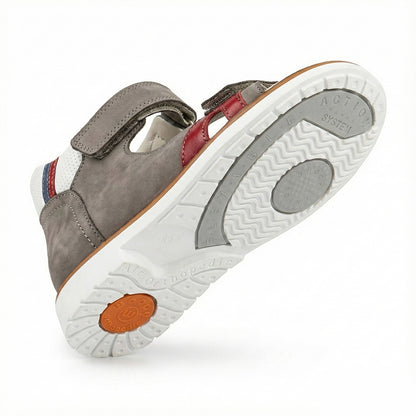 Supportive children’s orthopedic shoe with arch and ankle support, Thomas heels, and shock-absorbing sole.