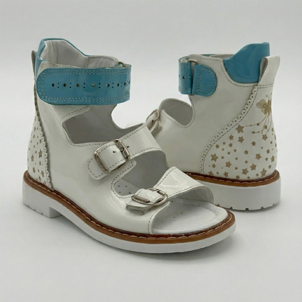 Supportive children’s orthopedic sandals with buckle straps, ankle and arch support, Thomas heels, and decorative butterfly and star accents..