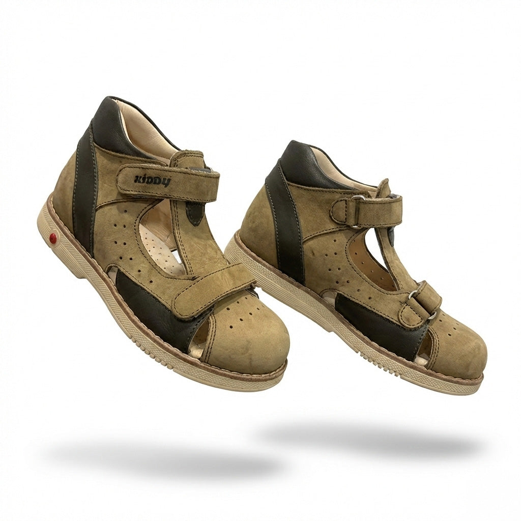 Kids’ orthopedic shoes in grey and black with Velcro closure, rugged sole,  arch and ankle support and Thomas heels.