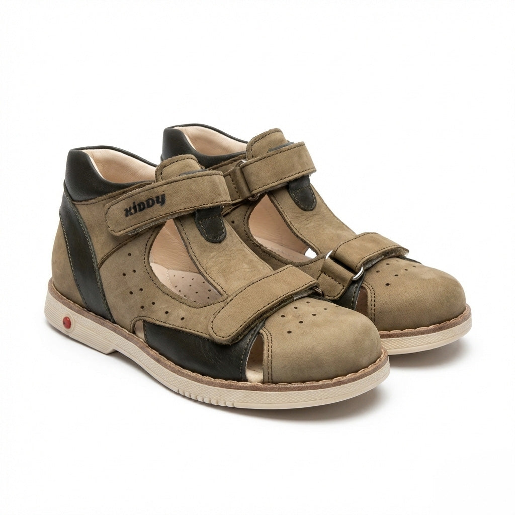 Kids’ orthopedic shoes in grey and black with Velcro closure, rugged sole,  arch and ankle support and Thomas heels.