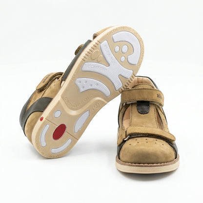 Kids’ orthopedic shoes in grey and black with Velcro closure, rugged sole,  arch and ankle support and Thomas heels.