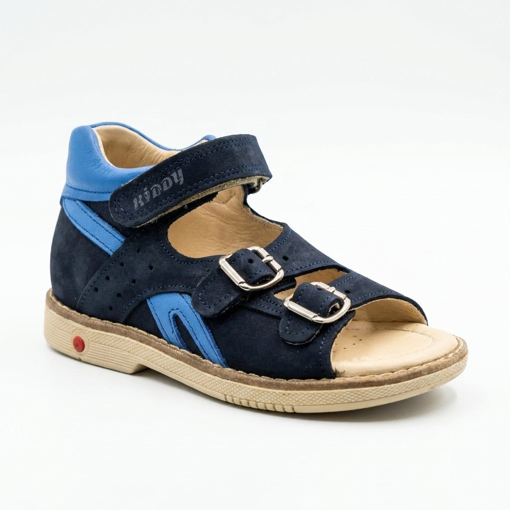 Mid-top orthopaedic sandals in navy nubuck and bright blue leather with structured cream sole and built-in Thomas heel.