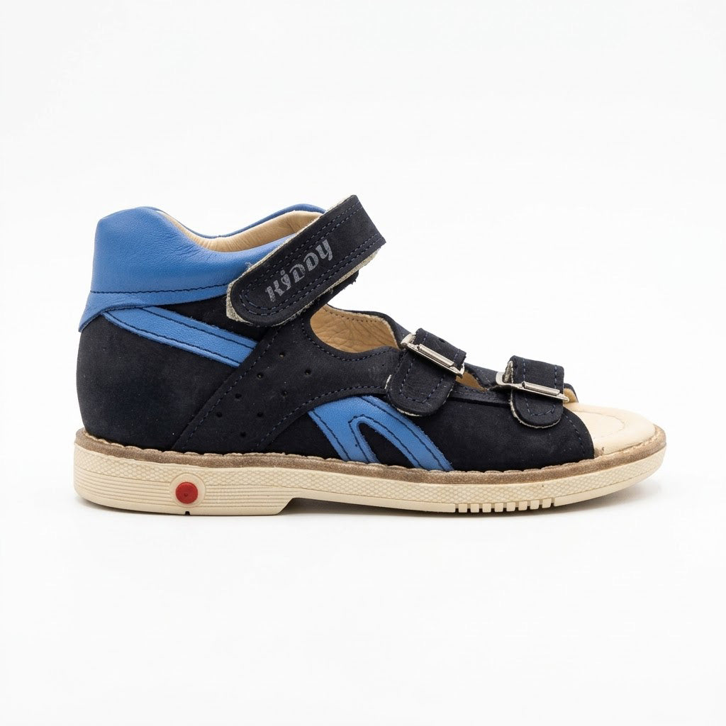 Mid-top orthopaedic sandals in navy nubuck and bright blue leather with structured cream sole and built-in Thomas heel.