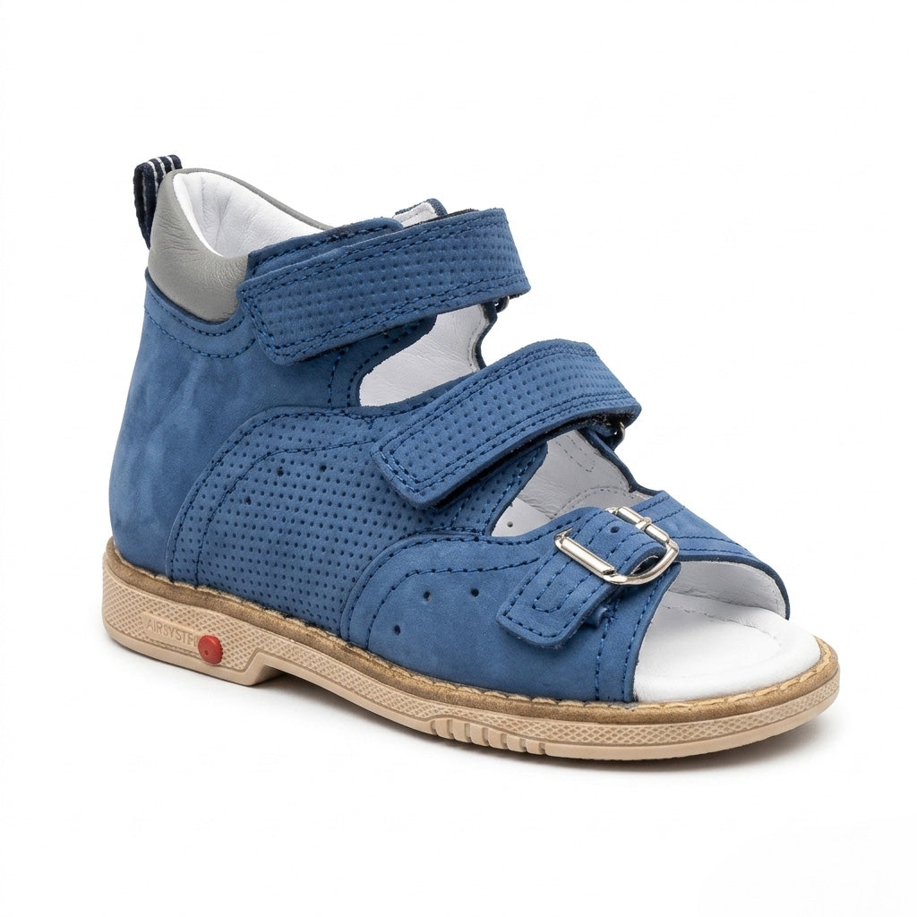 Profile of boys blue leather sandals showing structured ankle support, micro-perforations, and a Thomas heel.
