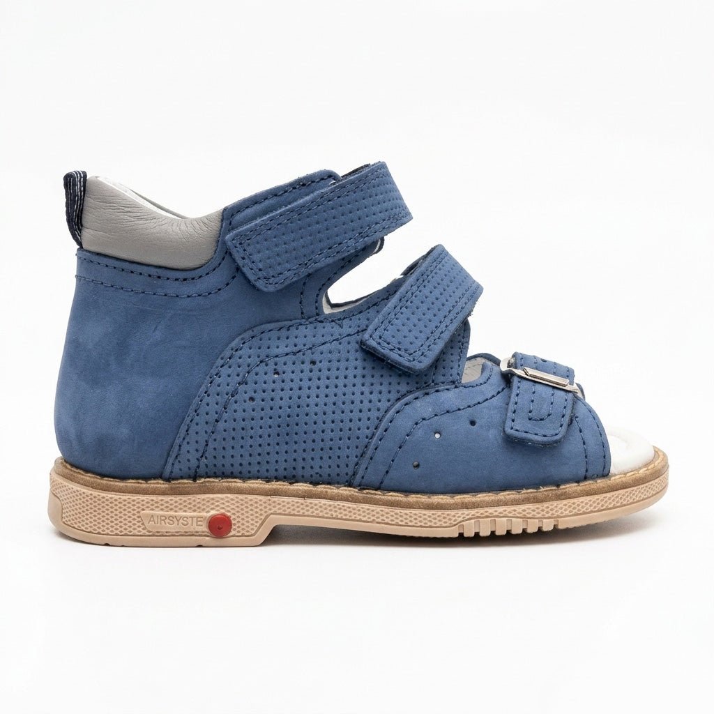 Profile of boys blue leather sandals showing structured ankle support, micro-perforations, and a Thomas heel.