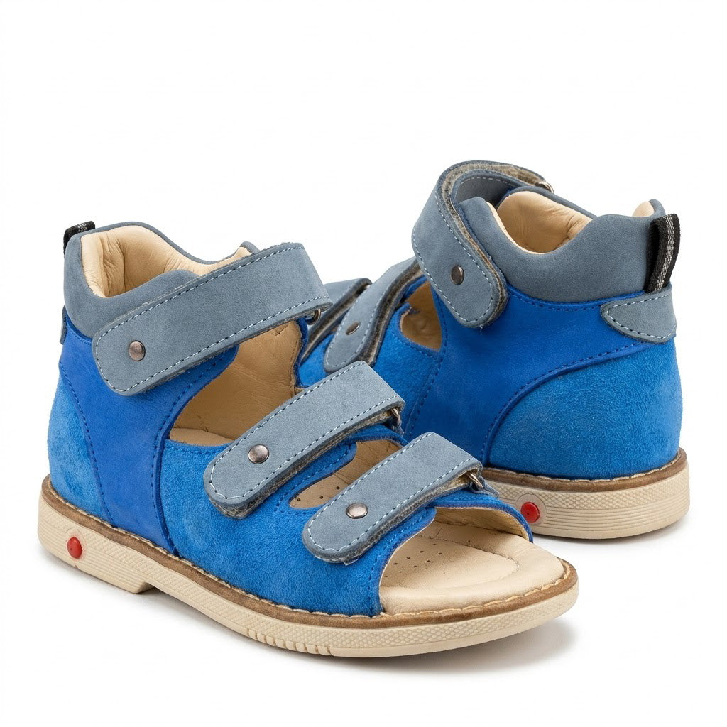 Blue nubuck orthopaedic sandals showing padded mid-top collar, firm heel counter, and sturdy Thomas heel