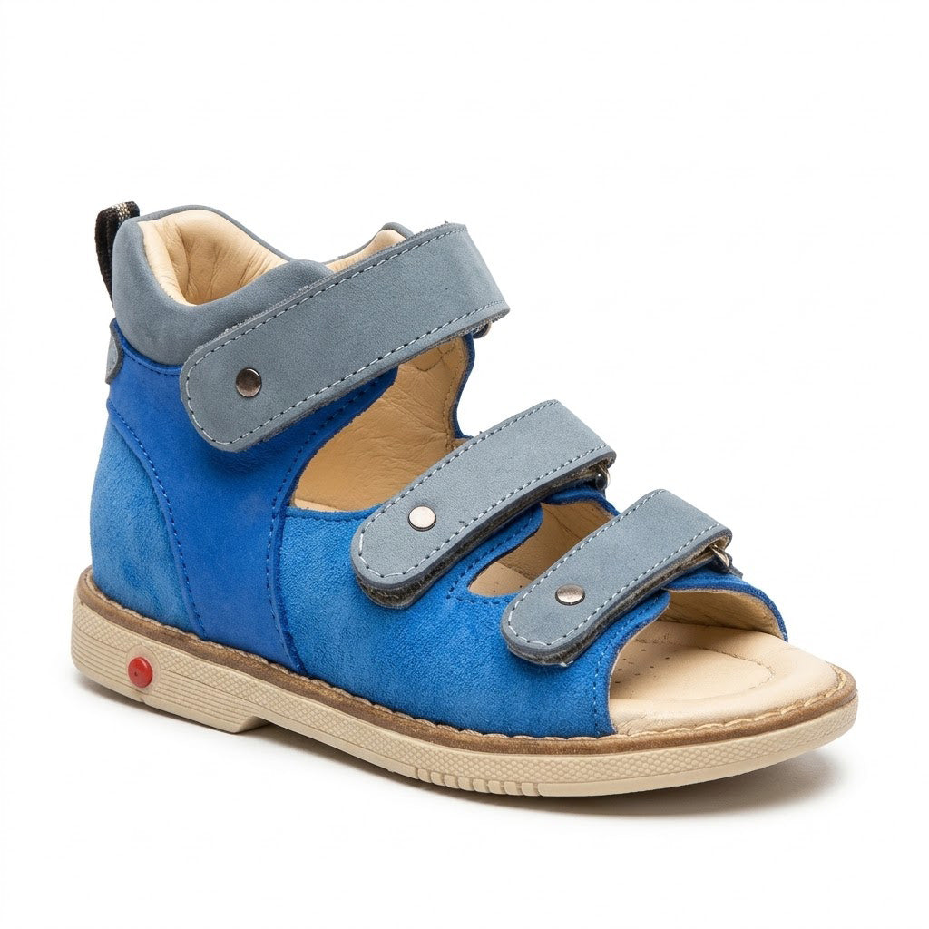 Blue nubuck orthopaedic sandals showing padded mid-top collar, firm heel counter, and sturdy Thomas heel