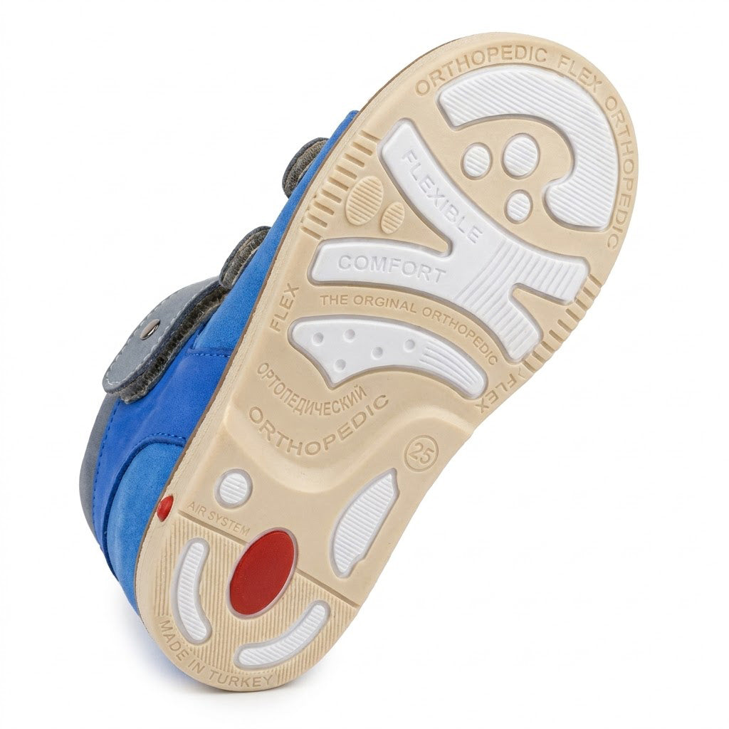 Orthopaedic sandal sole with Thomas heel support zones, shock absorption insert, and sturdy traction grip