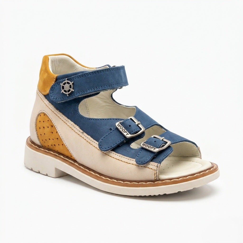 Mid-top orthopaedic sandals showing a cream sole, sturdy traction pattern, Thomas heel, three straps and a tiny silver helm charm.