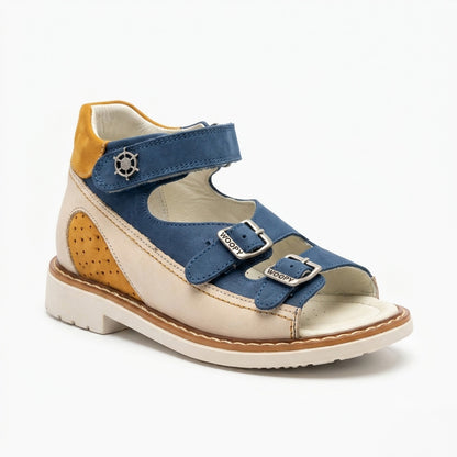 Mid-top orthopaedic sandals showing a cream sole, sturdy traction pattern, Thomas heel, three straps and a tiny silver helm charm.