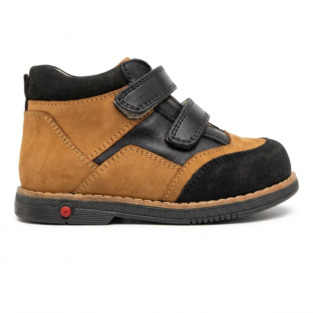 Side view of boys' nubuck and leather orthopaedic boots featuring double Velcro straps and supportive Thomas heels.