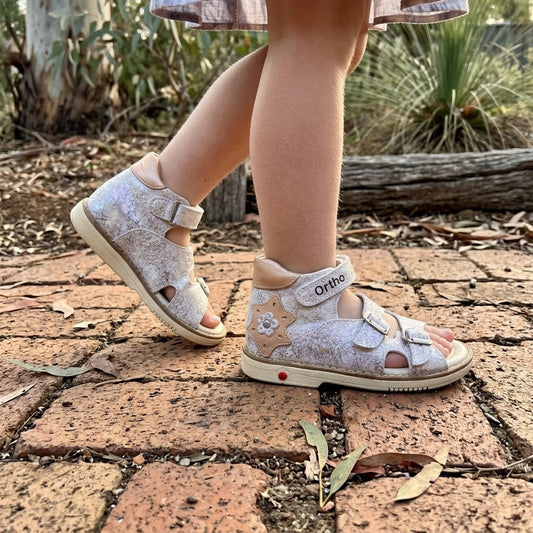 Girls silver crackle orthopaedic sandals with rose gold star applique, 3 straps, and sturdy cream soles.