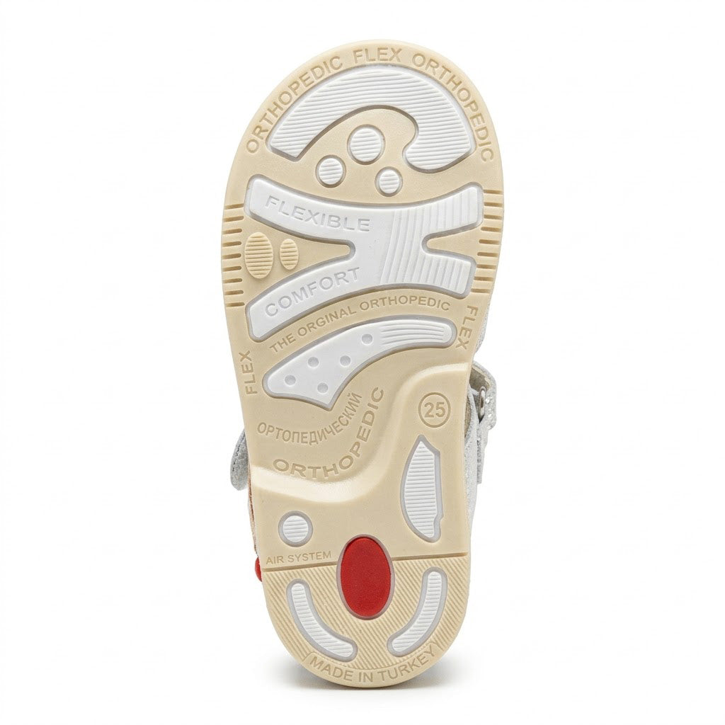 Orthopaedic shock-absorbing grooved traction sole with built-in Thomas heel and posture control system.