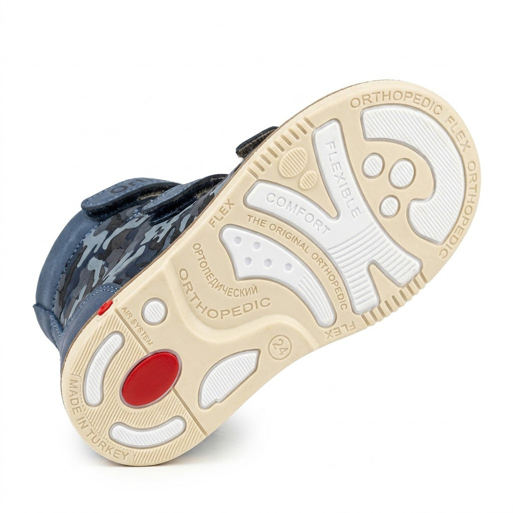Sturdy traction outsole featuring orthopaedic Thomas heel, shock-absorbing red insert, and structured grip grooves.