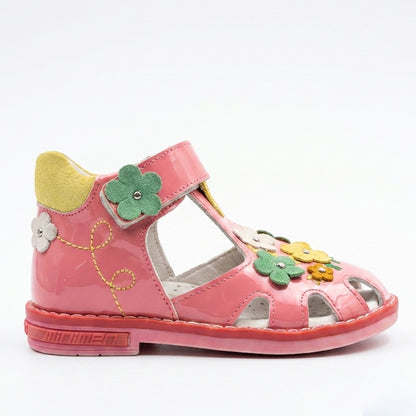 Children’s pink closed‑toe orthopedic sandals with Velcro straps, flower accents, arch and ankle support, featuring Thomas heels by Minimen.