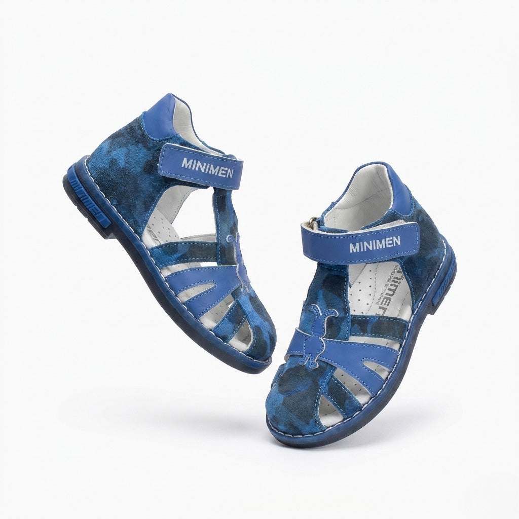 Blue Minimen kids’ orthopedic sandal featuring supportive construction with arch support, ankle stability, and a Thomas heel, displayed against a clean background.