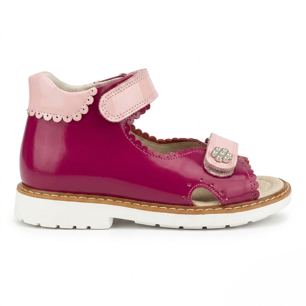 Mid-top fuchsia leather girls sandals with extended Thomas heel, padded pink collar, and sturdy white traction sole