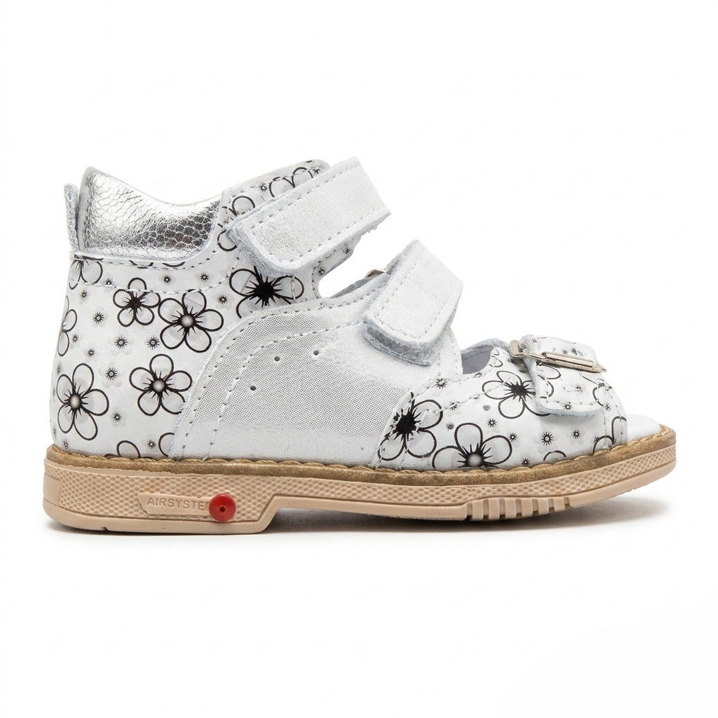Profile of girls silver floral leather sandals showing a mid-top ankle collar and adjustable straps.