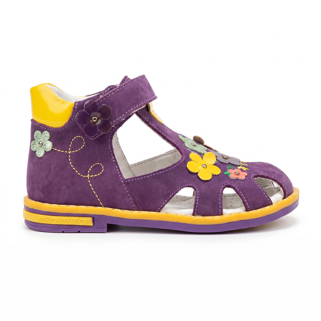 Children’s purple orthopedic sandal with Velcro strap, arch support, ankle stability, Thomas heel, and colourful flower details by Minimen.