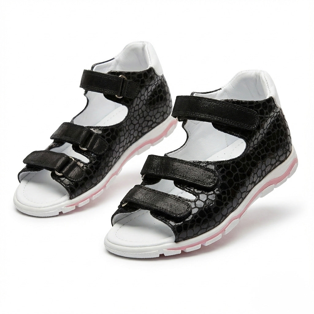 Orthopaedic black orthopedic sandals with three Velcro straps, open toe design, arch support, and ankle support.