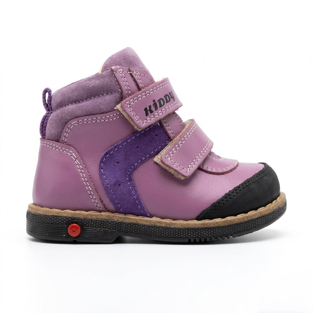 Kids’ purple orthopedic boots with Velcro straps, arch support, ankle stability, Thomas heels, and cushioned tan soles.