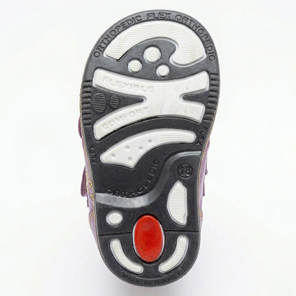 Kids’ purple orthopedic boots with Velcro straps, arch support, ankle stability, Thomas heels, and cushioned tan soles.