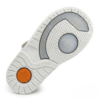Sturdy orthopaedic white outsole with shock-absorbing inserts, non-slip tread traction, and extended Thomas heel.