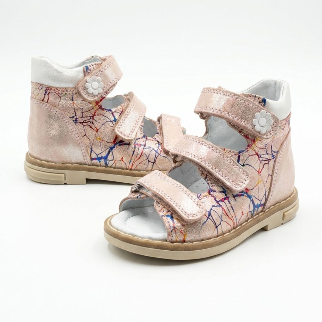 Side view of shimmer pink leather mid top sandals with padded collar and structured ankle support.