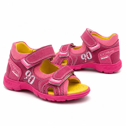 Bright pink low-top orthopaedic sandal with padded collar, white stitching, and reinforced heel counter