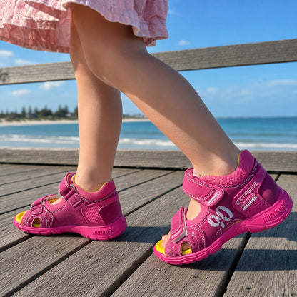 Girls pink orthopaedic low-top sandals with yellow footbed, arch support, and dual Velcro straps