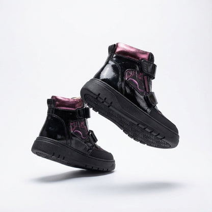Children’s orthopedic high-top shoes in black and purple with Velcro straps, arch and ankle support, and bold design by Ortho Shoes.