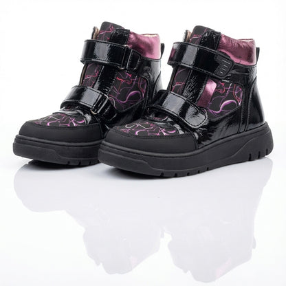 Children’s orthopedic high-top shoes in black and purple with Velcro straps, arch and ankle support, and bold design by Ortho Shoes.