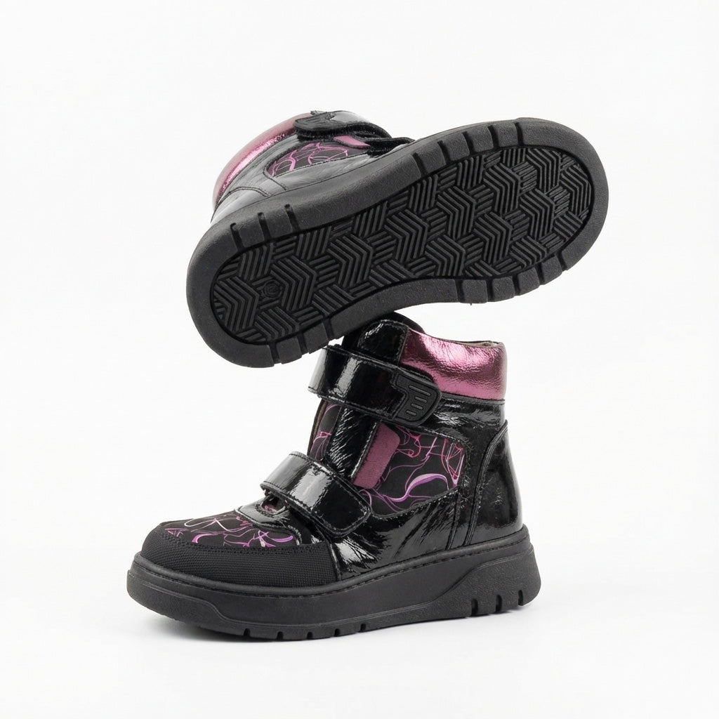 Children’s orthopedic high-top shoes in black and purple with Velcro straps, arch and ankle support, and bold design by Ortho Shoes.