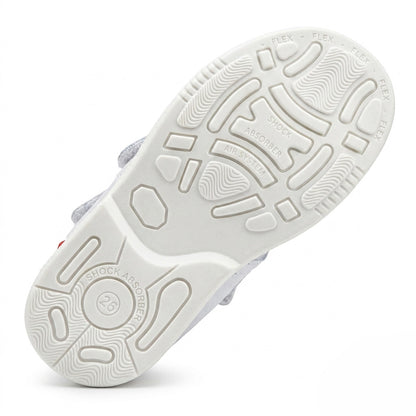 White shoe sole featuring built-in shock absorber traction patterns and an integrated Air System.