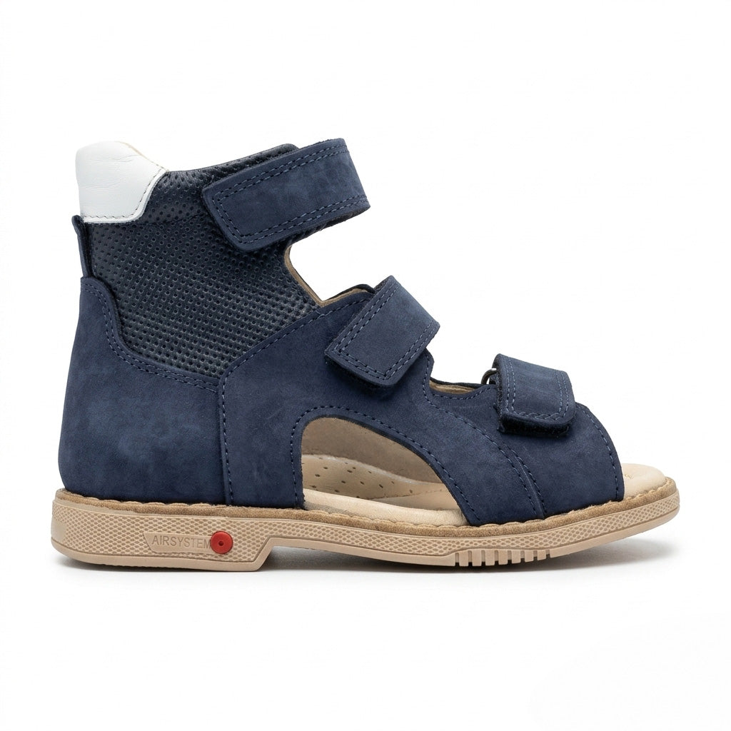 Profile of boys navy leather sandals featuring a high top collar, textured panel, and a sturdy cream sole.