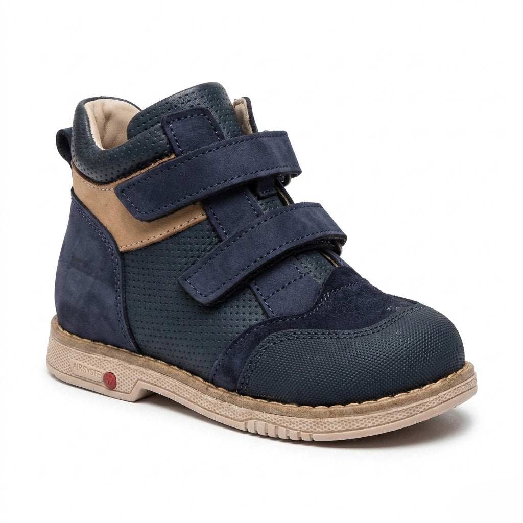 Side view of Oliver Navy Brown boys orthopaedic boot showing the extended Thomas heel and structured cream sole by Ortho Shoes.