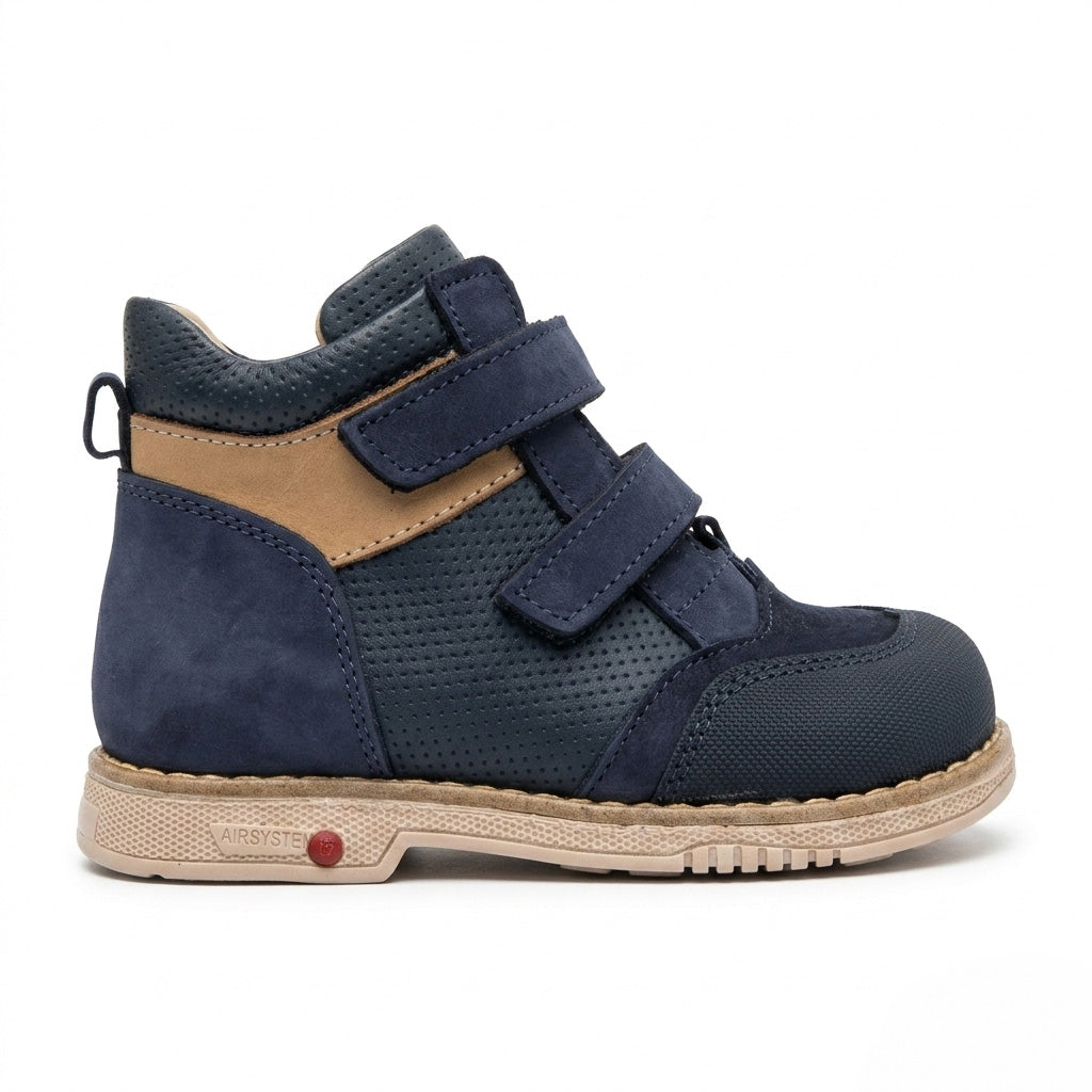 Side view of Oliver Navy Brown boys orthopaedic boot showing the extended Thomas heel and structured cream sole by Ortho Shoes.