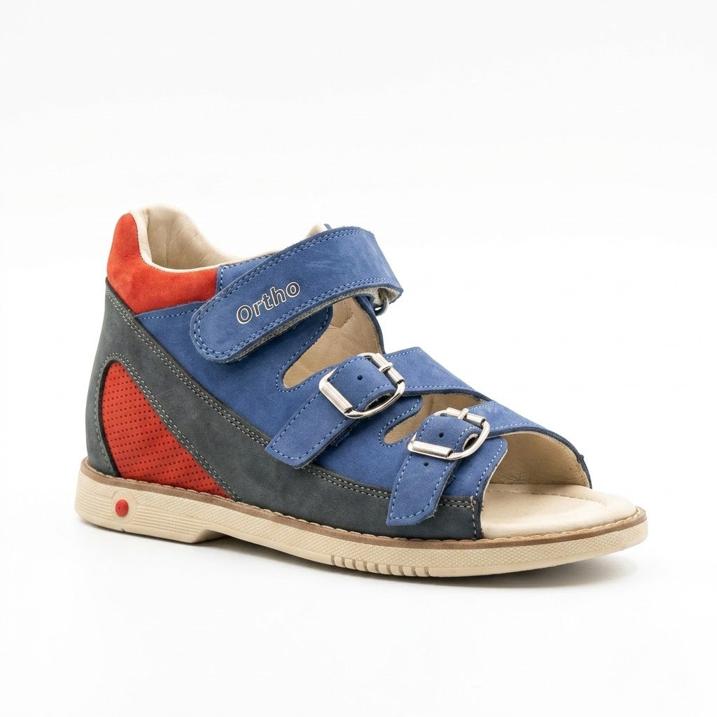 Side view of boys blue and red mid-top sandals showing secure Velcro ankle strap and buckle details.