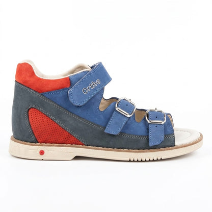 Side view of boys blue and red mid-top sandals showing secure Velcro ankle strap and buckle details.
