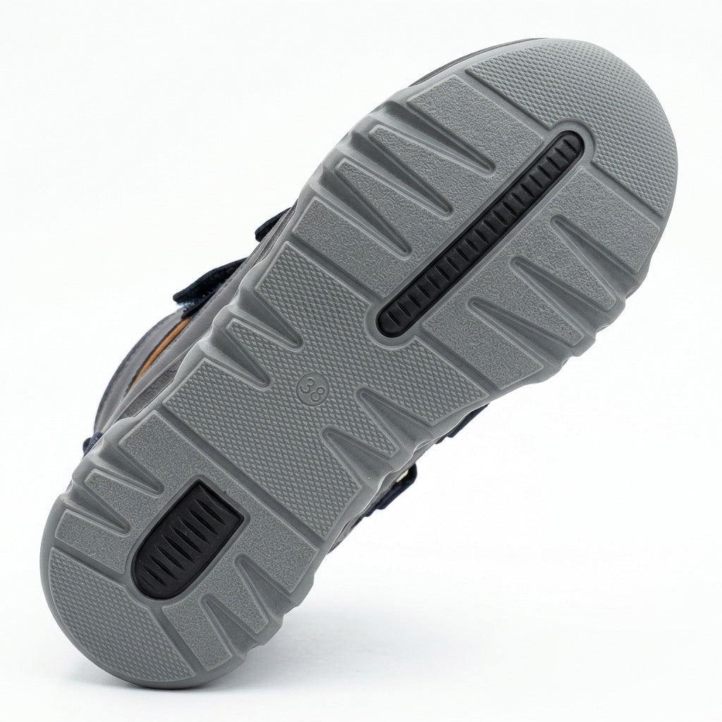 Kids orthopedic boots in dark blue with Velcro straps, rugged grey sole, arch and ankle support, and Ortho branding.
